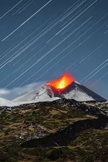 Vertical Prints: Star trail above the south-east crater of Mount Etna during strombolian eruption with lava fountains