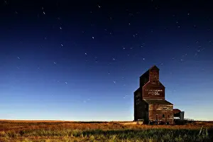 Elevator Prints: Star trails and moonlit grain elevator in ghost town Bents Saskatchewan, Canada