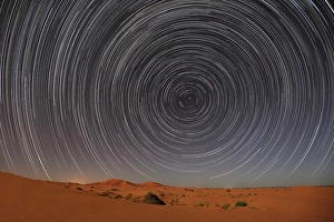 Q1 2025 Prints: Star trails over sand dunes at night