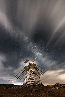 Dramatic Sky Prints: Starry sky above the stone windmill, La Oliva, Fuerteventura, Canary Islands, Spain