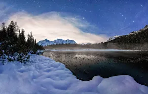 Cloudscape Prints: Stars over the frozen lake Entova and snowy forest at night