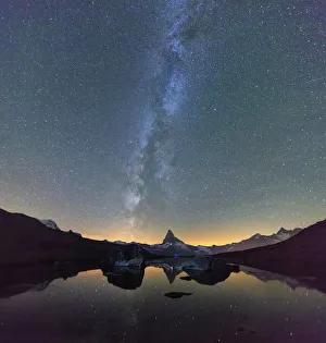 Stars and Milky Way above the Matterhorn reflected in Lake Stellisee Zermatt Canton Stars and Milky Way above the Matterhorn reflected in Lake Stellisee Zermatt Canton