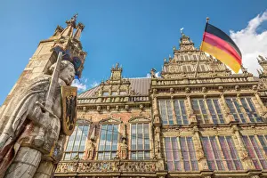 Roland Statue Prints: Statue of Bremen Roland in front of the town hall with the German flag on the market square