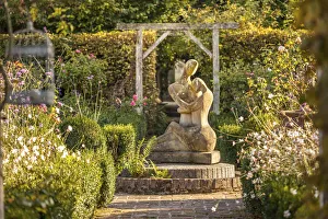 Lovers Prints: statue in the garden of Les Jardins de Pays d`Auge, Cambremer, Calvados, Normandy, France