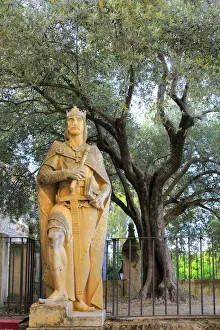 Statue of King Alfonso X at the entrance of Alcazar of the Christian Kings (Alcazar