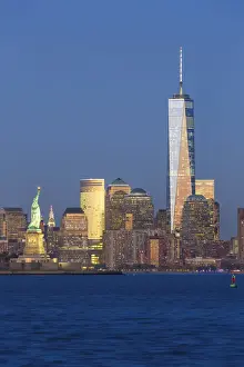 Statue of Liberty, One World Trade Center and Downtown Manhattan across the Hudson River