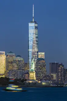 Statue of Liberty, One World Trade Center and Downtown Manhattan across the Hudson River