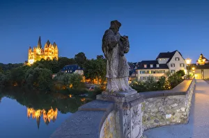 Statue on Old Lahn Bridge (Alte Lahnbrucke), Cathedral (Dom) and River Lahn at dusk