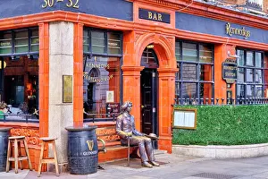 Leinster Prints: A Statue of Oscar Wilde sitting in front of the building where he lived for so many years