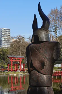 The statue of a Samurai in the foreground with the Buenos Aires Japanese Garden' The statue of a Samurai in the foreground with the Buenos Aires Japanese Garden'