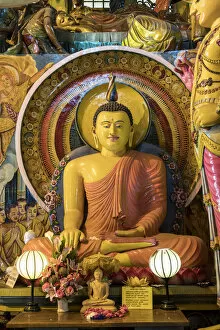 Statue of sitting Buddha a Gangaramaya temple in Colombo, Sri Lanka