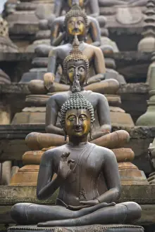 Buddhas Prints: Statues of sitting Buddhas a Gangaramaya temple in Colombo, Sri Lanka