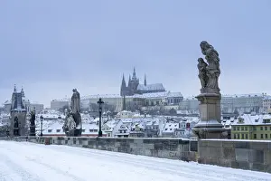 Ceska Republika Prints: Statues at snow-covered Charles bridge and Prague Castle in winter, Prague, Bohemia