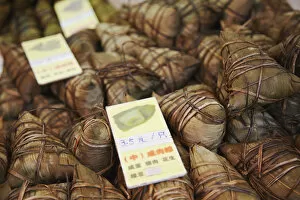 Images Dated 30th January 2012: Sticky rice dumplings (zongzi) at market, Guangzhou, Guangdong, China