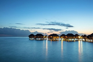 Society Islands Prints: Stilted over-water hotel suites at dusk