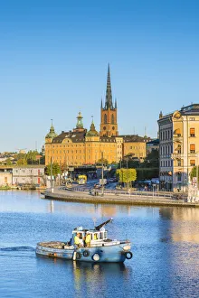 Images Dated 5th January 2017: Stockholm, Sweden, Northern Europe. Fishing boat passing in front of Riddarholmen