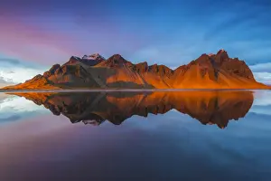 Stokksnes, Iceland. Vestrahorn mountain mirrors in the waters of the Stokksnes bay