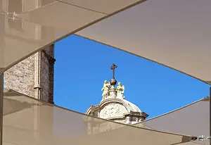Framing Prints: Stone angels and a cross on a bronze sphere on the top of the Iron Gate of La Catedral del Santo Caliz