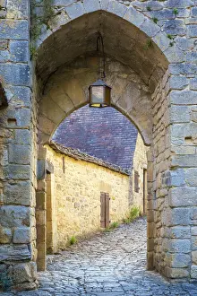 Cobblestones Prints: Stone arched passage along medieval alley in Beynac-et-Cazenac, Dordogne Department