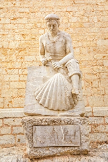 Craftsmanship Prints: Stonemason monument in front of the church of Binissalem