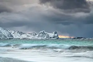 Mountain Peak Prints: Storm clouds at sunset over snowcapped mountains and cold arctic sea