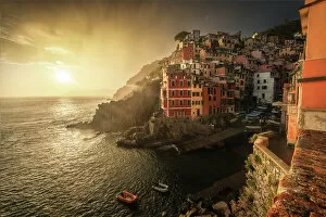 Pier Collection: A stormy summer sunset in the town of Riomaggiore, one of the Cinque Terre. Cinque Terre, Italy