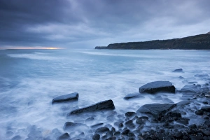 Stormy sunset at Kimmeridge Bay on the Jurassic Coast, Dorset, England. Winter