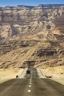 Straight road and mountains, near Ash Shuwaymiyyah, Dhofar Governorate, Oman