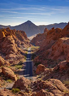 Straight road between red rocks during sunny day, Valley of Fire State Park, Nevada Straight road between red rocks during sunny day, Valley of Fire State Park, Nevada