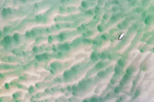 Overhead Prints: Stranded boat at low tide on the Town Bar sandbar near Rock, Cornwall, England