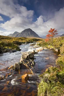 A stream runs through an autumnal Rannoch Moor towards Buachaille Etive Mor, Highlands A stream runs through an autumnal Rannoch Moor towards Buachaille Etive Mor, Highlands