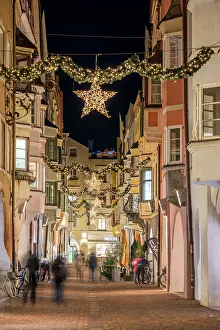 Brixen Prints: Street adorned with festive Christmas decorations, Brixen-Bressanone, South Tyrol, Italy
