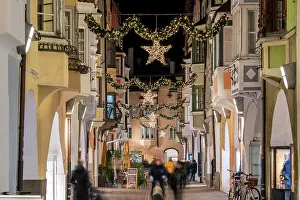Brixen Prints: Street adorned with festive Christmas decorations, Brixen-Bressanone, South Tyrol, Italy