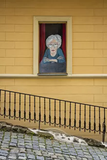 Street art of senior woman looking out of window, Loket, Sokolov District