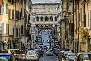 Street in Monti district with Colosseum in the background, Rome, Lazio, Italy