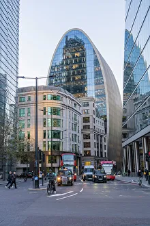 A street scene looking towards 70 St Mary Axe also known as The Can of Ham, City of London, London, England, Uk