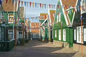Streets of Marken decorated for Koningsdag, or Kings Day, with flags of Dutch