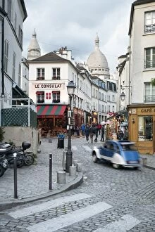 Images Dated 19th May 2017: Streets of Montmartre with view towards Basilica Sacre Coeur, Paris, France