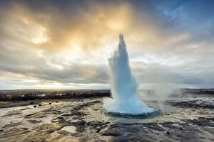 Images Dated 25th February 2016: Strokkur Geyser eruption at dawn, Haukadalur Geothermal Area, Haukadalur, Arnessysla