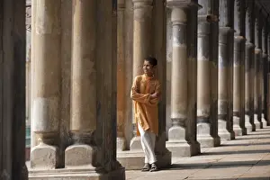 Old Building Prints: A student relaxes beside the pillars of the impressive Hugli Imambara building which was built in 1858