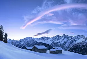 Images Dated 14th August 2019: Stunning clouds above huts at sunrise. Soglio, Bregaglia Valley, Canton of Grisons