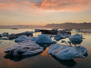 Sudurland Prints: Summer sunset at Jokusarloon glacier Lagoon with many iceberg in the bay, Iceland