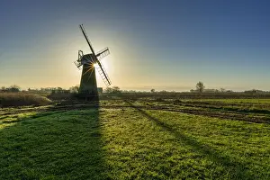 Thurne Prints: Sun Bursting Behind St. Benets Mill, Norfolk Broads National Park, England