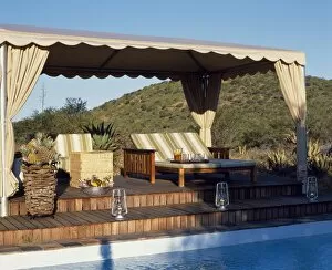 Safari Lodge Gallery: Sun loungers on a canopied deck beside the swimming pool at Uplands Homestead
