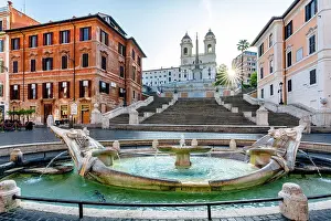 Steps And Staircases Prints: Sun rays at dawn over Piazza Di Spagna and Fontana Della Barcaccia, Rome, Italy