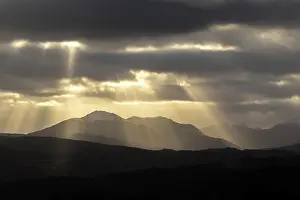 Rays Prints: Sun rays over the mountains of Cluanie Forest and Glenquoich Forest viewed from Glen Garry