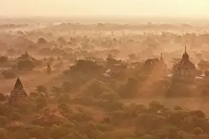 Pagodas Prints: Sun rays at sunrise over the Bagan Valley archaeological area temples