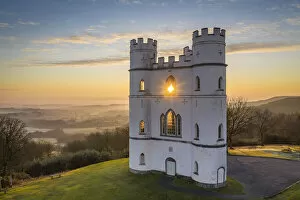 Drone Collection: Sun rising through Haldon Belvedere (Lawrence Castle), Devon, England