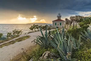 Agave Gallery: The sun is setting down behind St Peter lighthouse, in summer