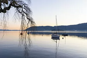 Lake Maggiore Collection: Suna, Verbania province, Piedmont, Italy Sailboat on a buoy, sunset hour